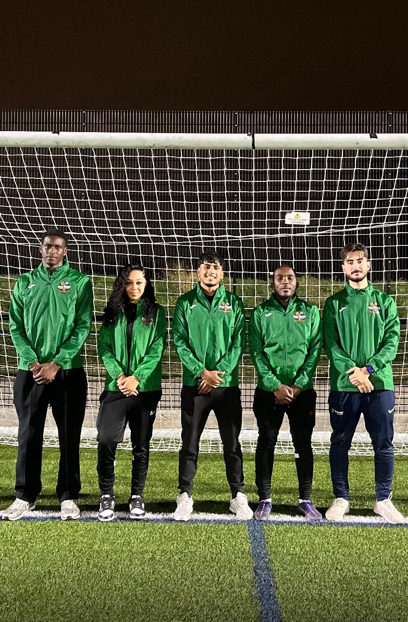 The Deen Squad Academy Coaching Team in their official green jackets